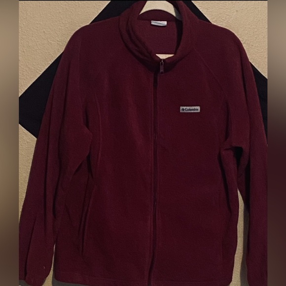 Crafted with cozy, plush fleece, zippered pockets, and a cold-blocking collar. - Picture 1 of 5